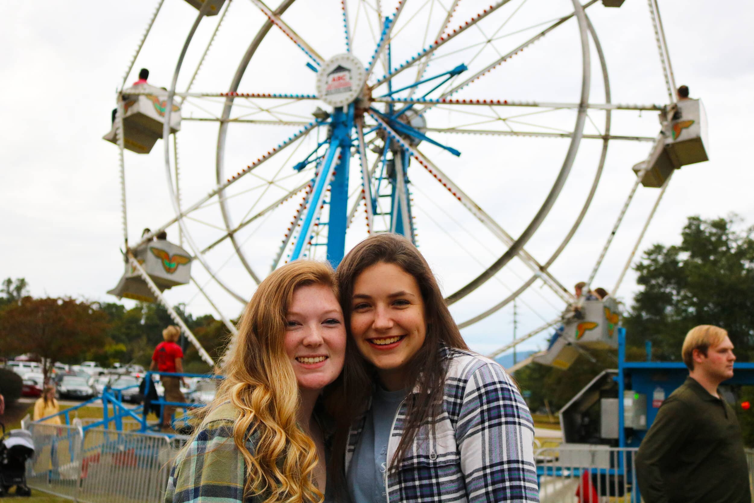 Sophomores Katelyn Watson and Lauren Gilliland pose for a picture in front of the Ferris wheel.