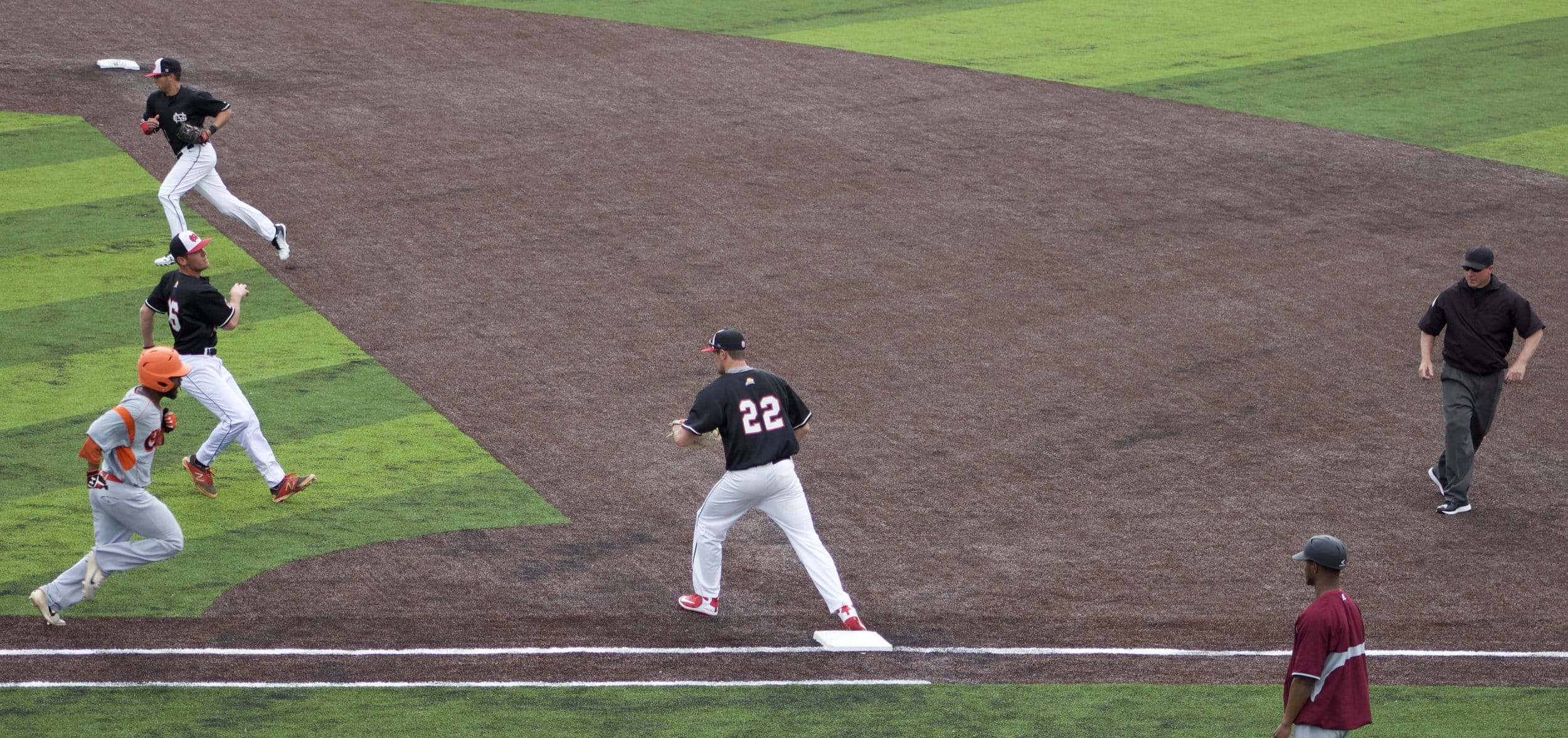 Trent Spikes and Andrew Plunkett shut down an attempt at first base.