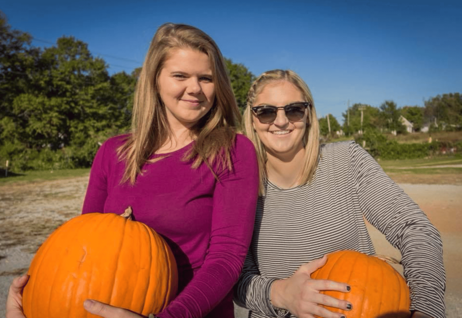 Juniors Harley Watkins and Savannah Hovis pick out pumpkins to carve for the holiday.&nbsp;