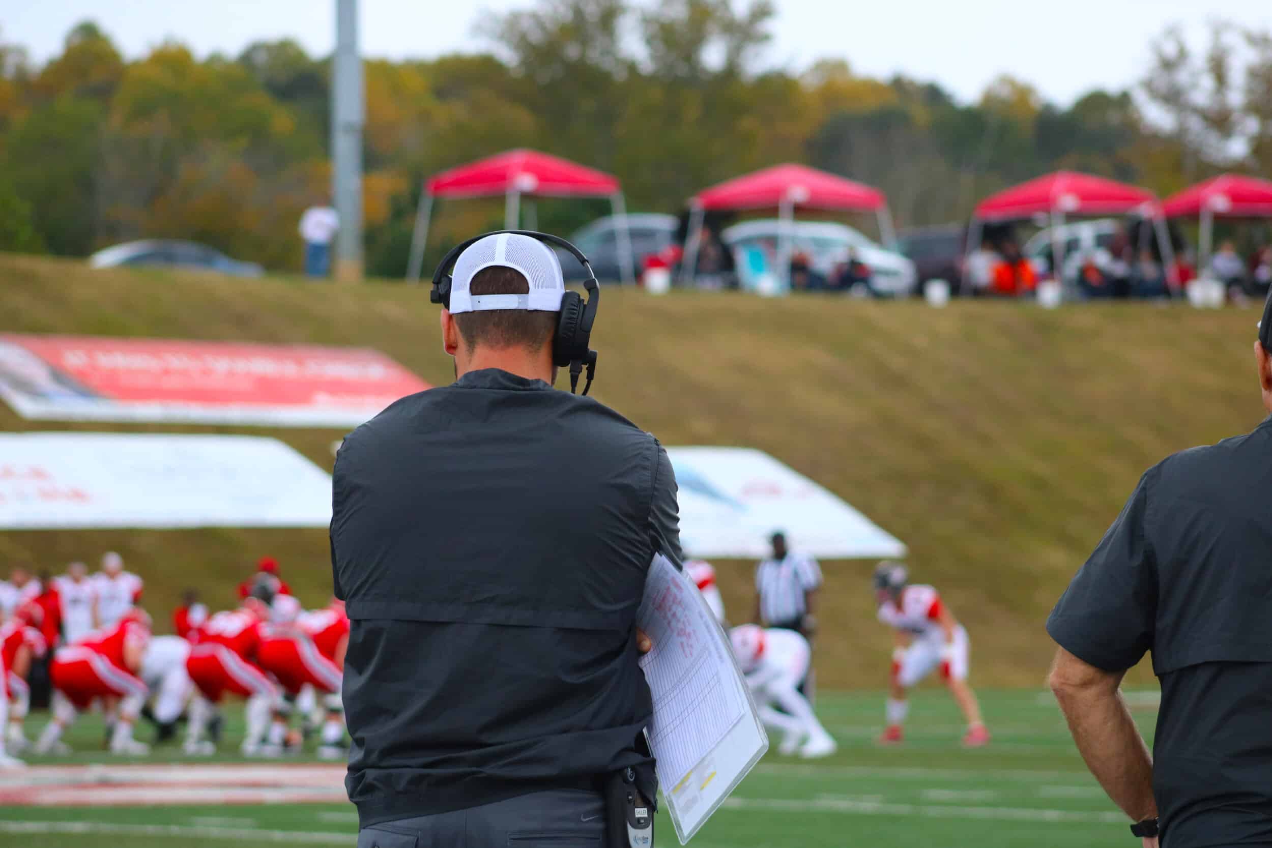 Offensive Line coach Will Shuler watch the boys on the line as they get ready for a play.