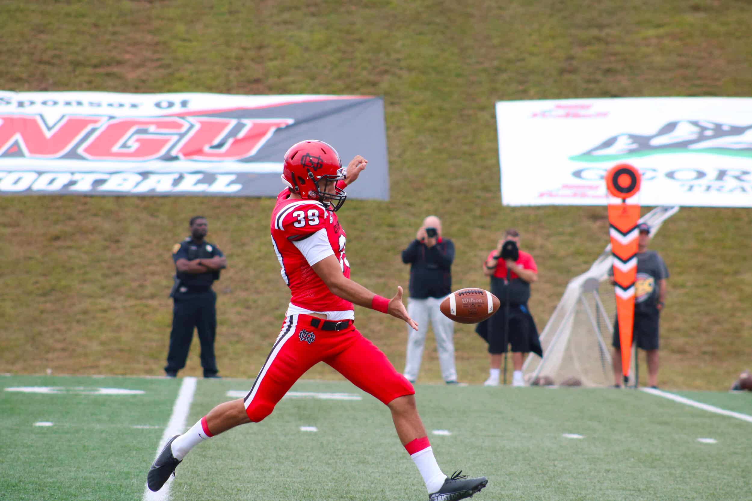 Senior Matt Gravely (39) kicks the ball down to the field to Valdosta State.