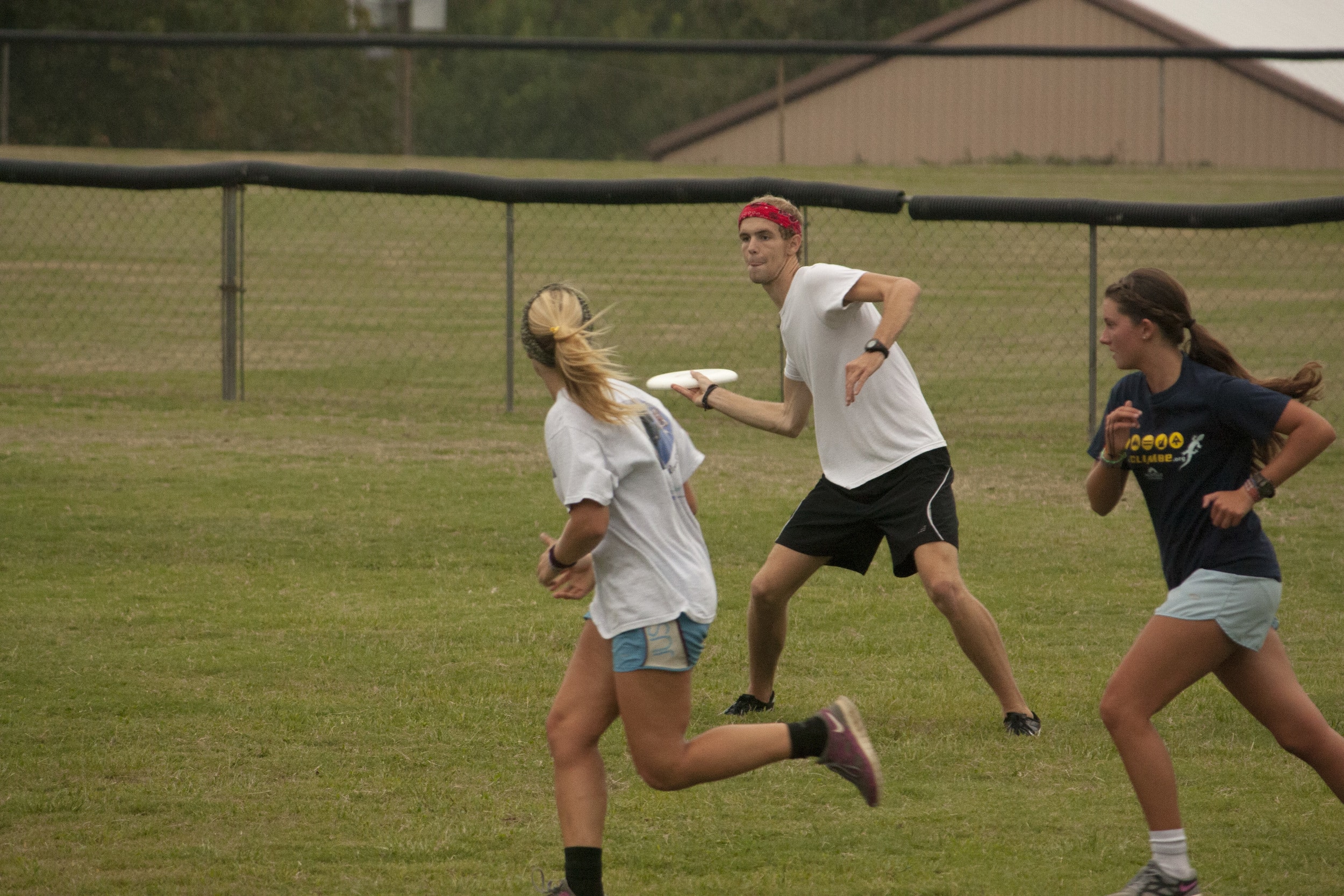 Tanner Furr, sophomore, intensely looks downfield to toss the Frisbee &nbsp;to a fellow teammate on one of NGU's fields.