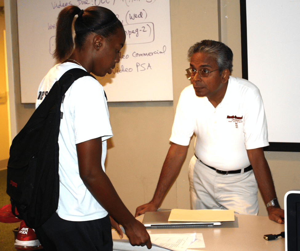 Shurajit Gopal talks with a student after one of his mass communication classes.