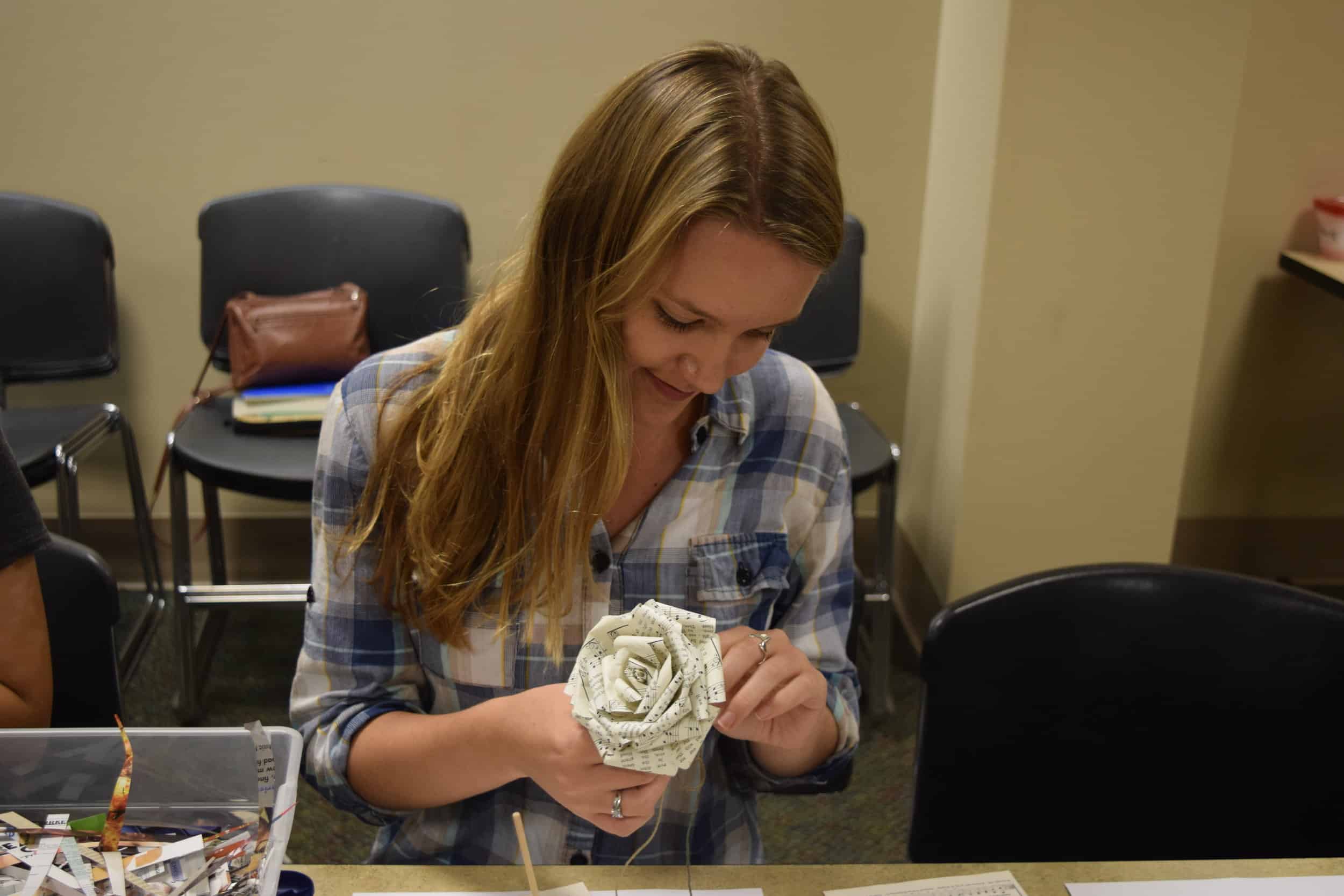 Bridget Pierce crafts her paper rose.