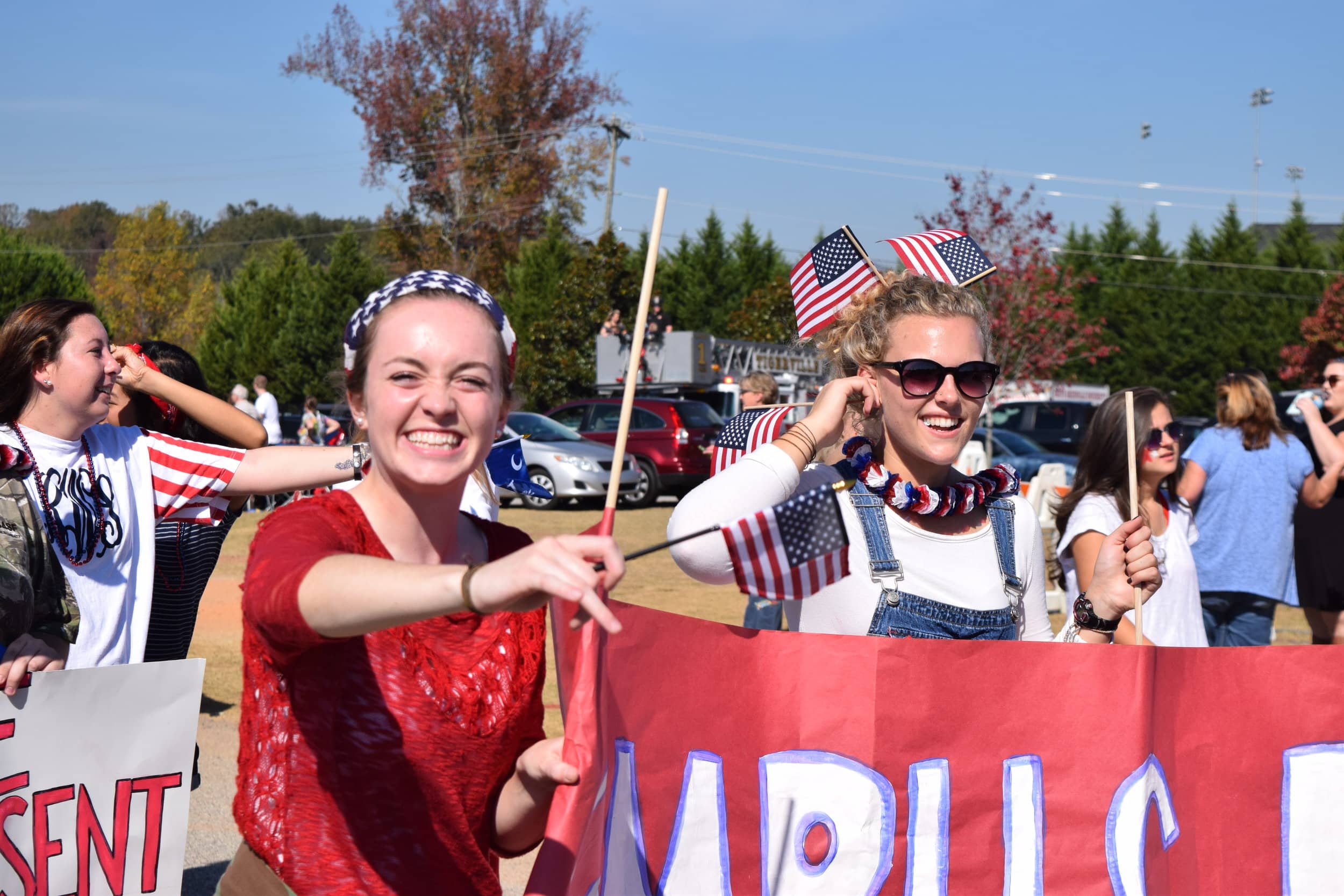 Caroline Kirkland and Hannah Reese show their patriotism as they walk in the parade.