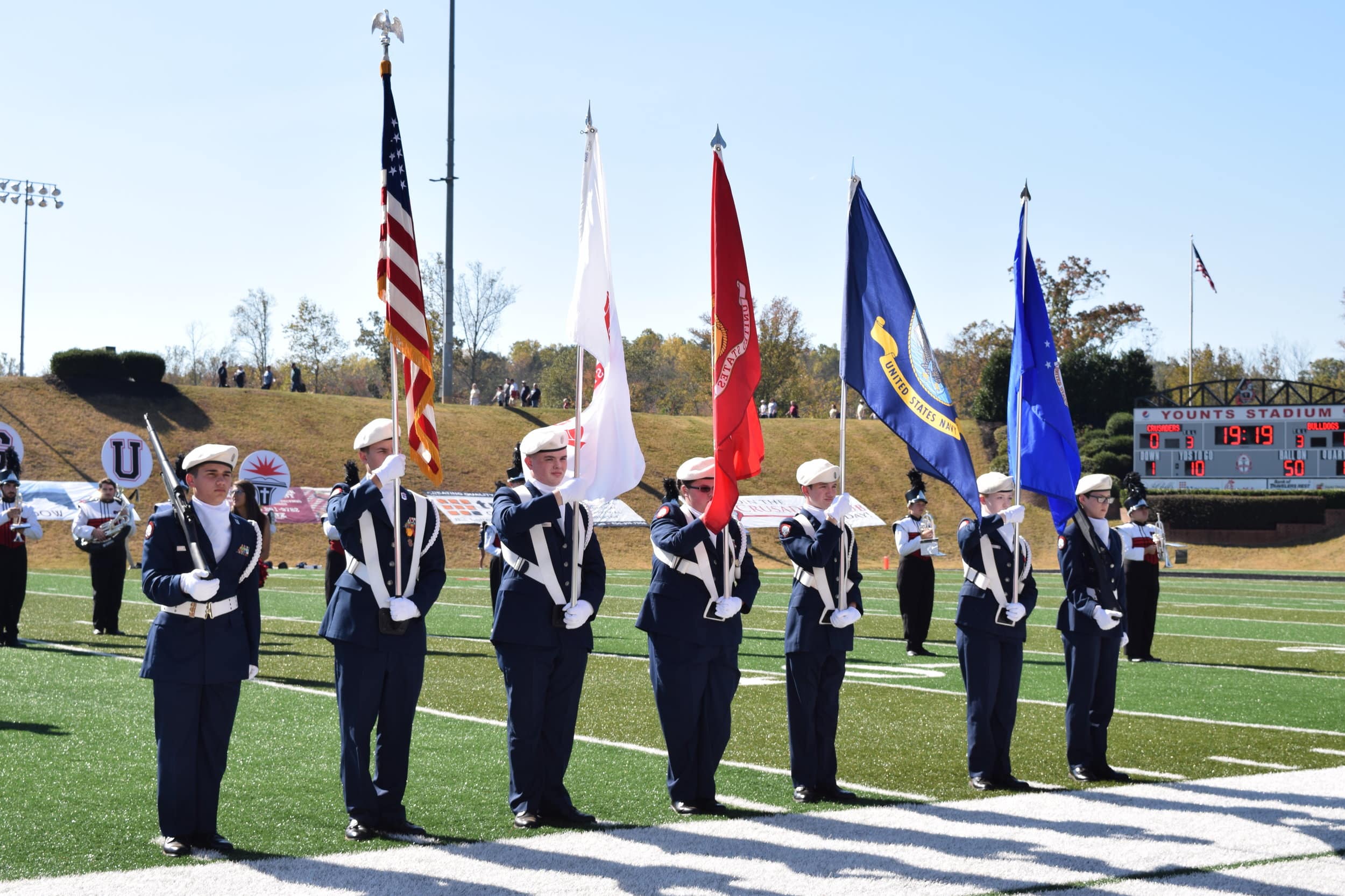 A local high school color guard presents the flags before kick-off.