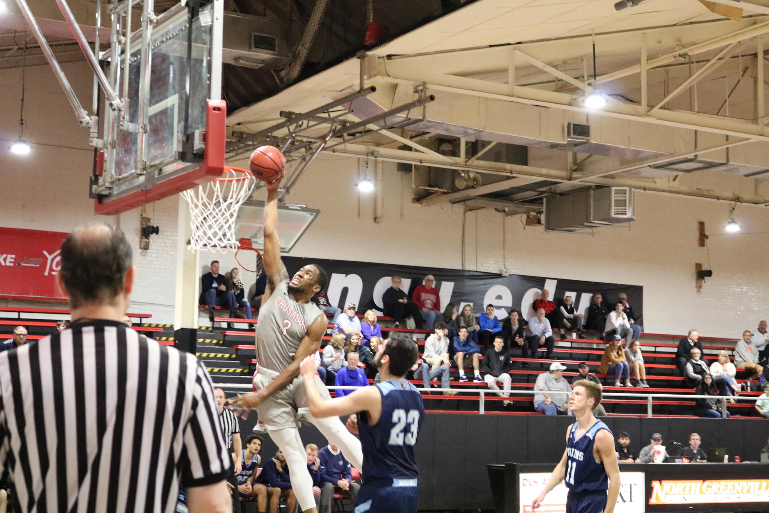 Tate (3) dunks the ball during the first half of the game.
