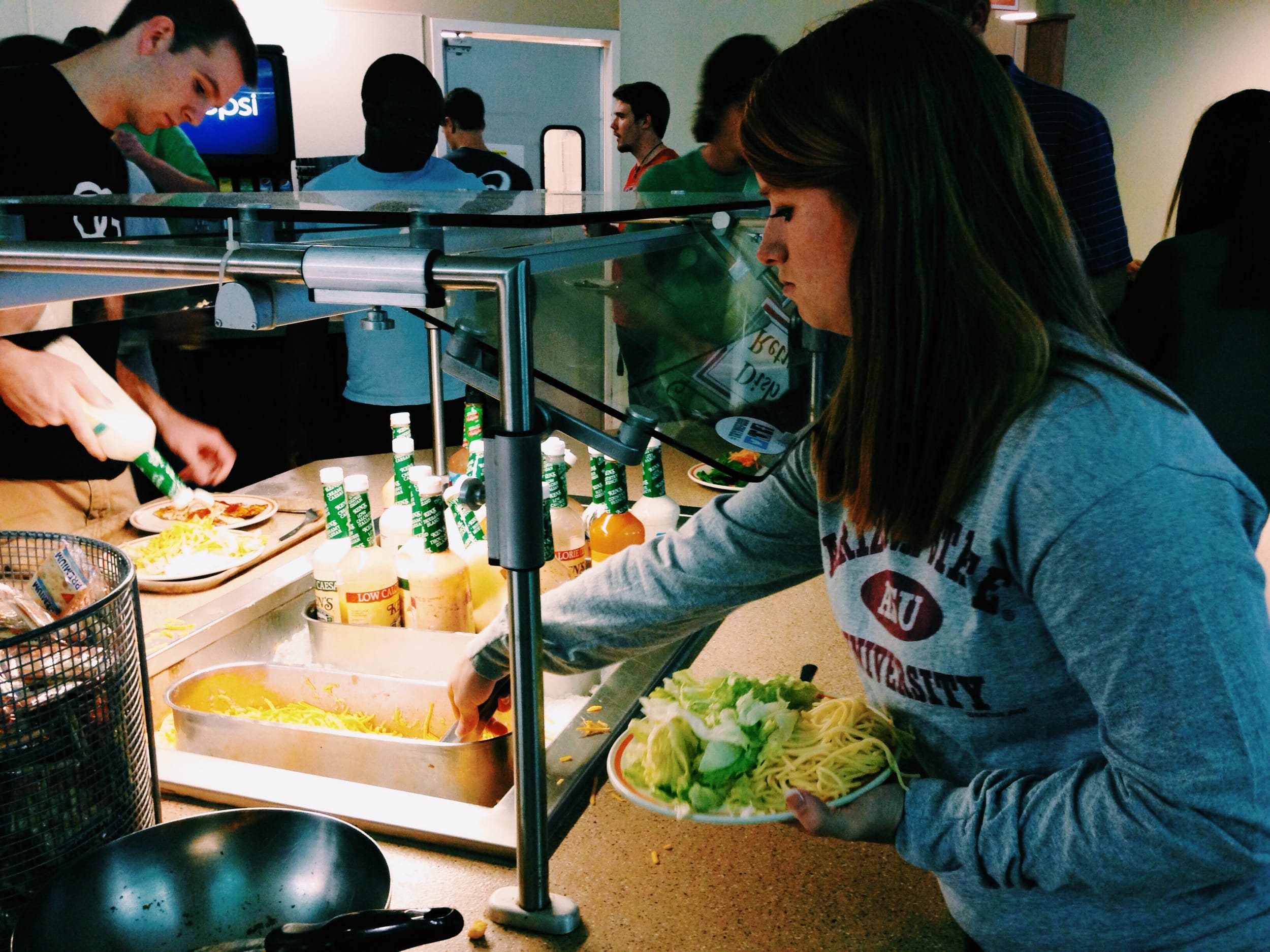  Kaitlyn makes a healthy choice by getting a salad. 