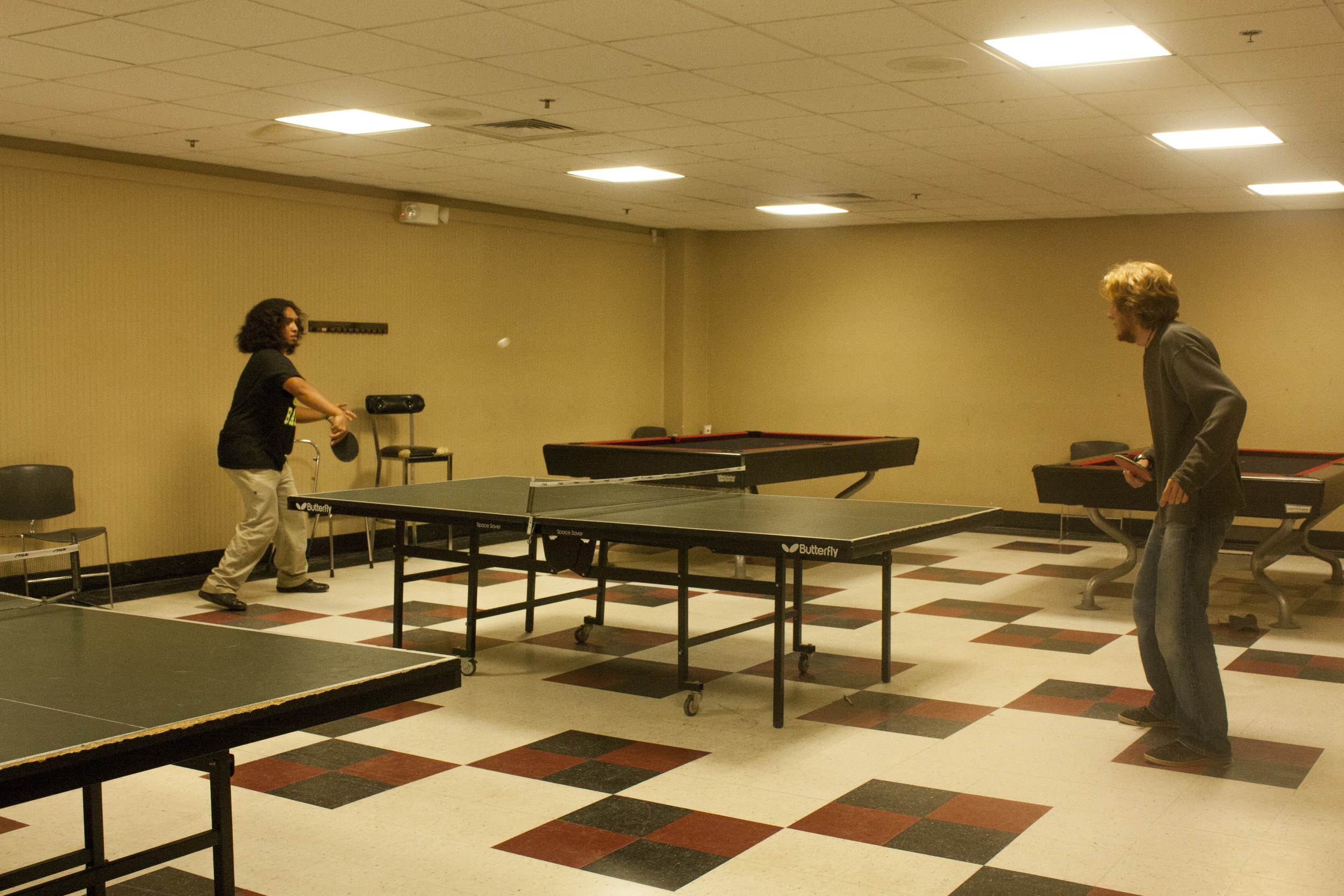 David Balles, sophomore, and Samuel Helms, sophomore, battle it out in a game of ping pong.