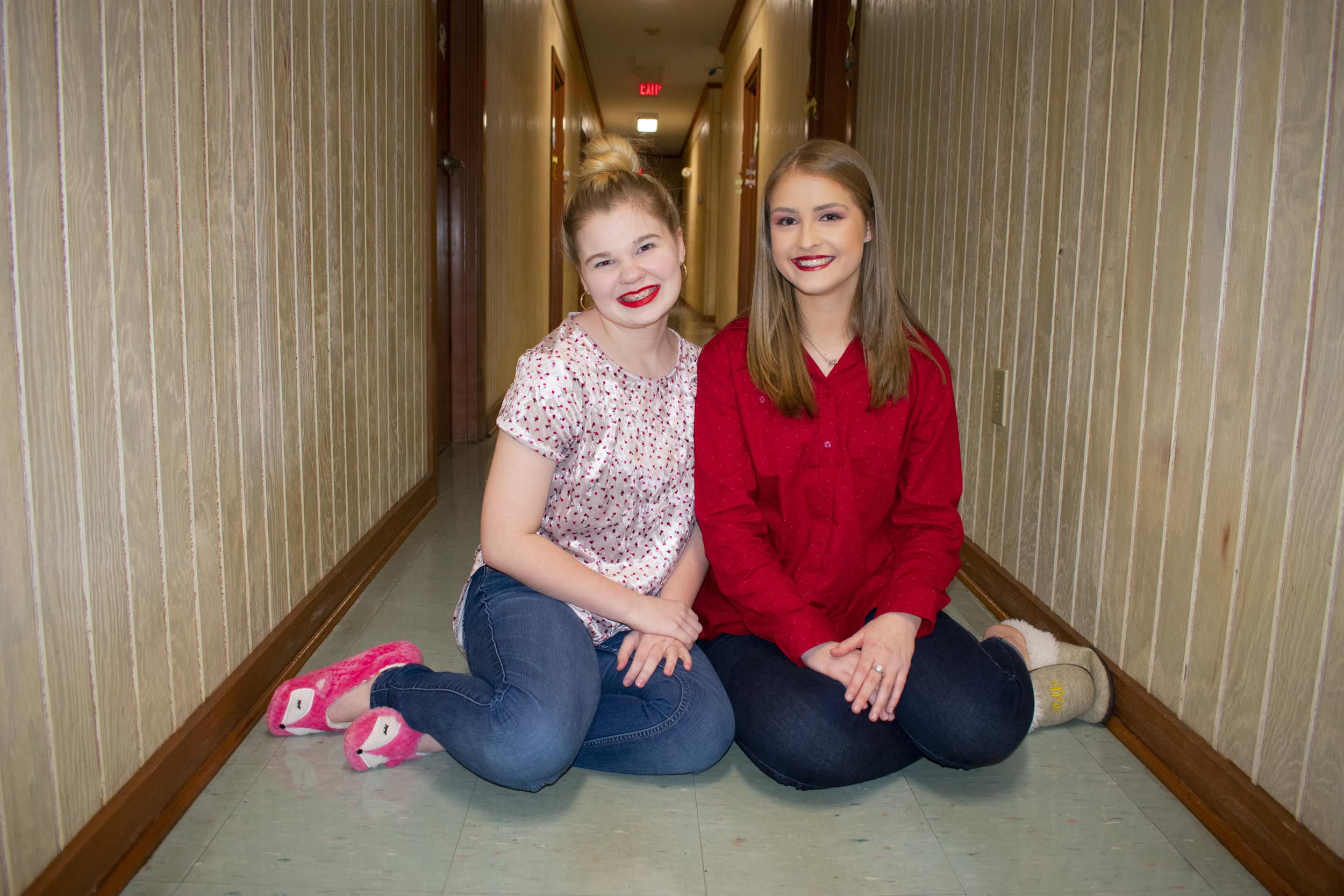 Hansen and Freshman Mary-Katherine Sizemore have an impromptu photoshoot in front of their dorm room in the Horton-Tingle residence hall.