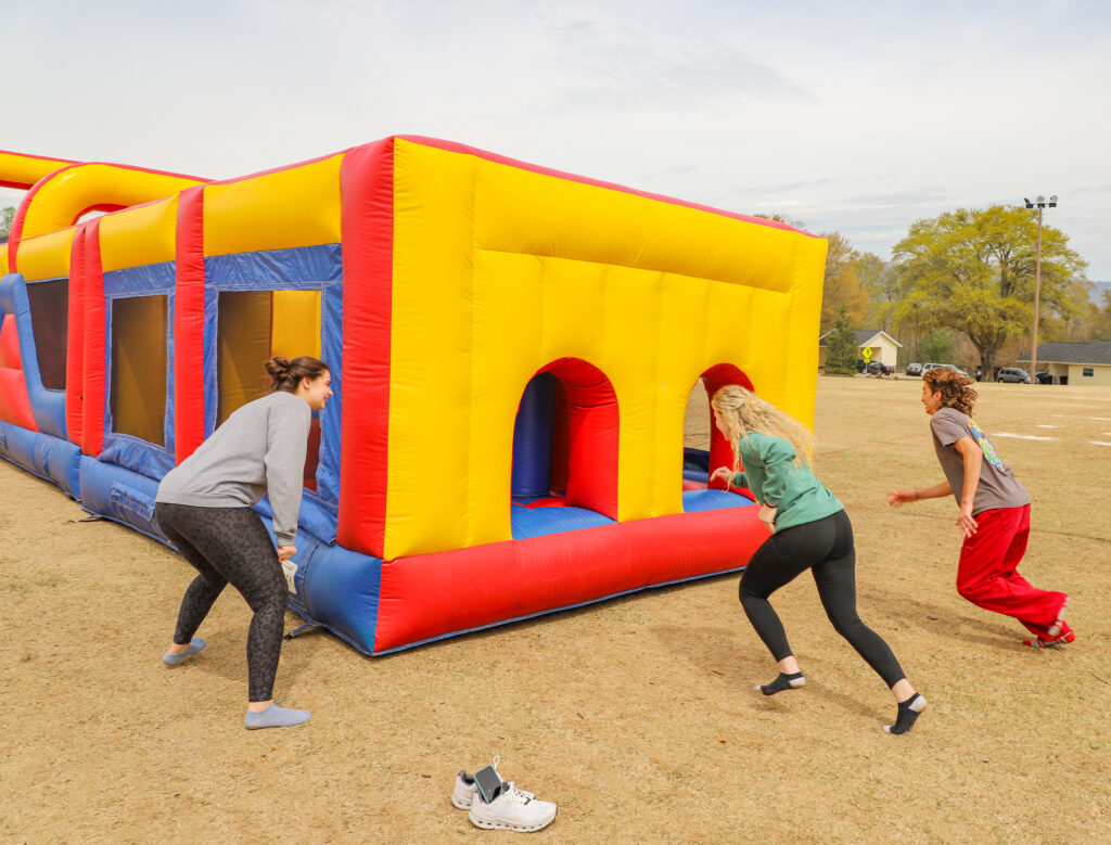 NGU students race through inflatable course during Spring Fling Week